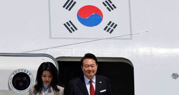 South Korean leader lands in Japan for first visit in 12 years for fence-mending summit